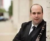 man smiling with clarinet